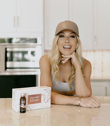 Image of emily standing on stage smiling